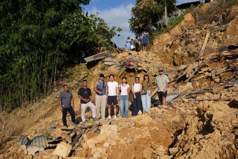 From Left: David Wangra and Nokong (MDBFA members) along with NIS Creators, Kenny Soru, Koko Imchen, Anon Wangshu, Naga Nuna, Nikali Shohe along with Filmmaker Kohdi Jings, at one of the affected sites in Defence Colony, Mon Town on August 10. (Photo Courtesy: @NagaNunaVlogs)